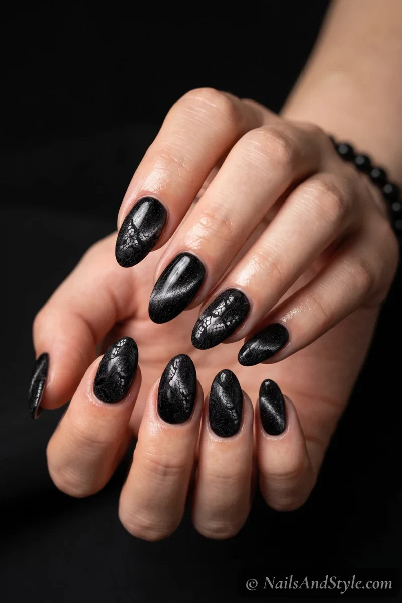 Black velvet almond nails with fine lace detailing