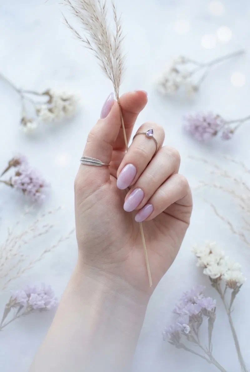 Sheer lilac mist nail polish on oval nails