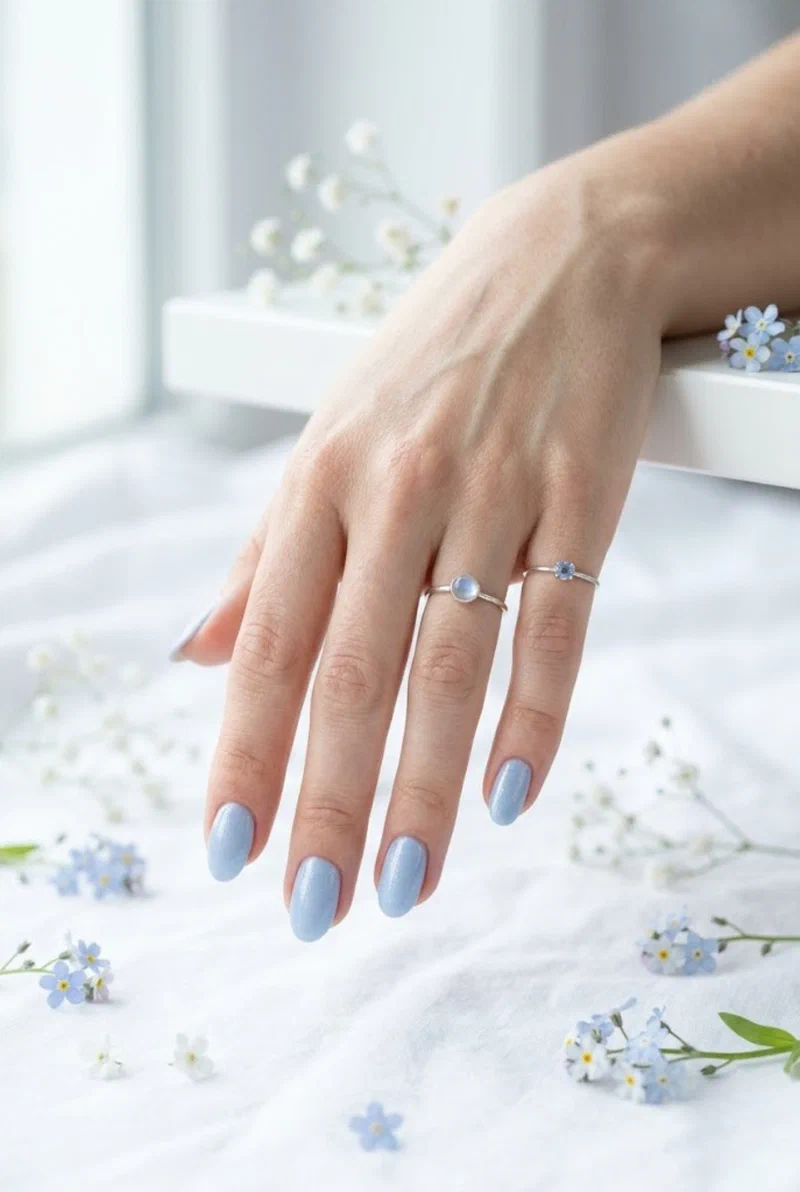 Powder blue nail polish on oval nails