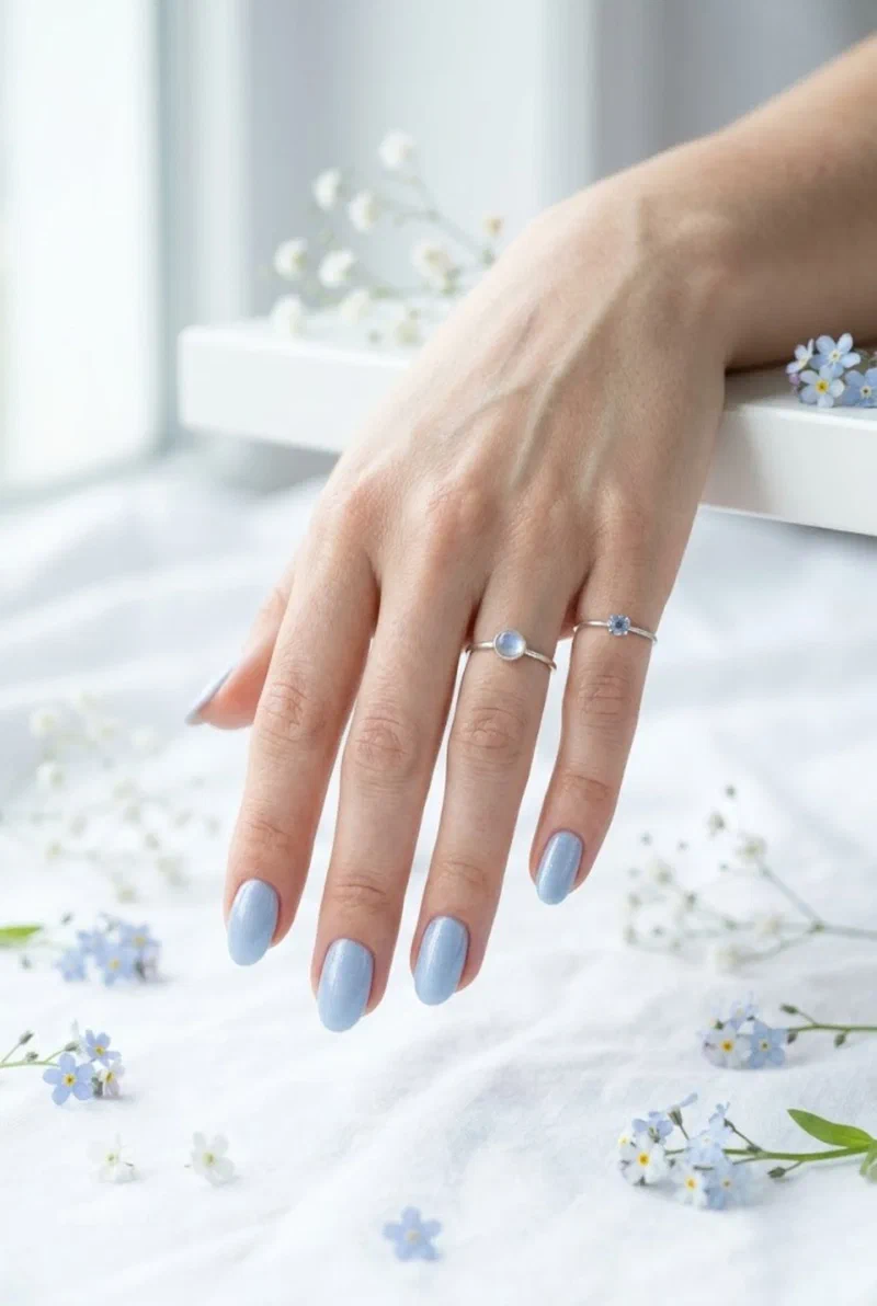 Powder blue nail polish on oval nails