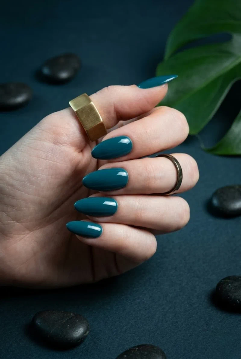 Teal nail polish on almond shaped nails