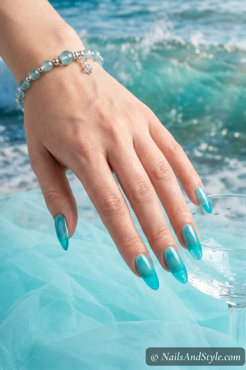 Sheer translucent aqua jelly nails with glossy candy-like finish