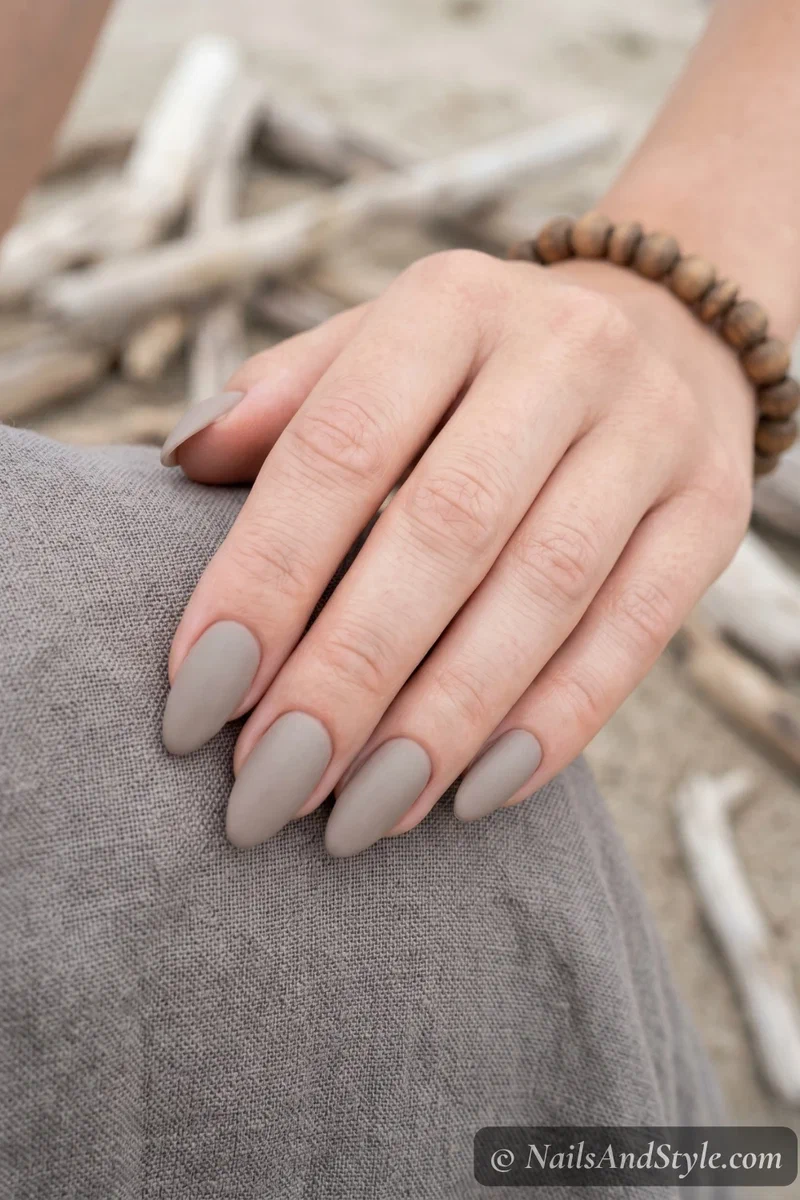 Warm grey-beige driftwood nude nails with matte finish
