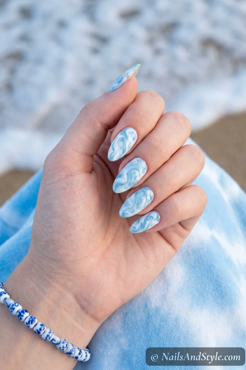 White and light blue marbled ocean foam swirl nails