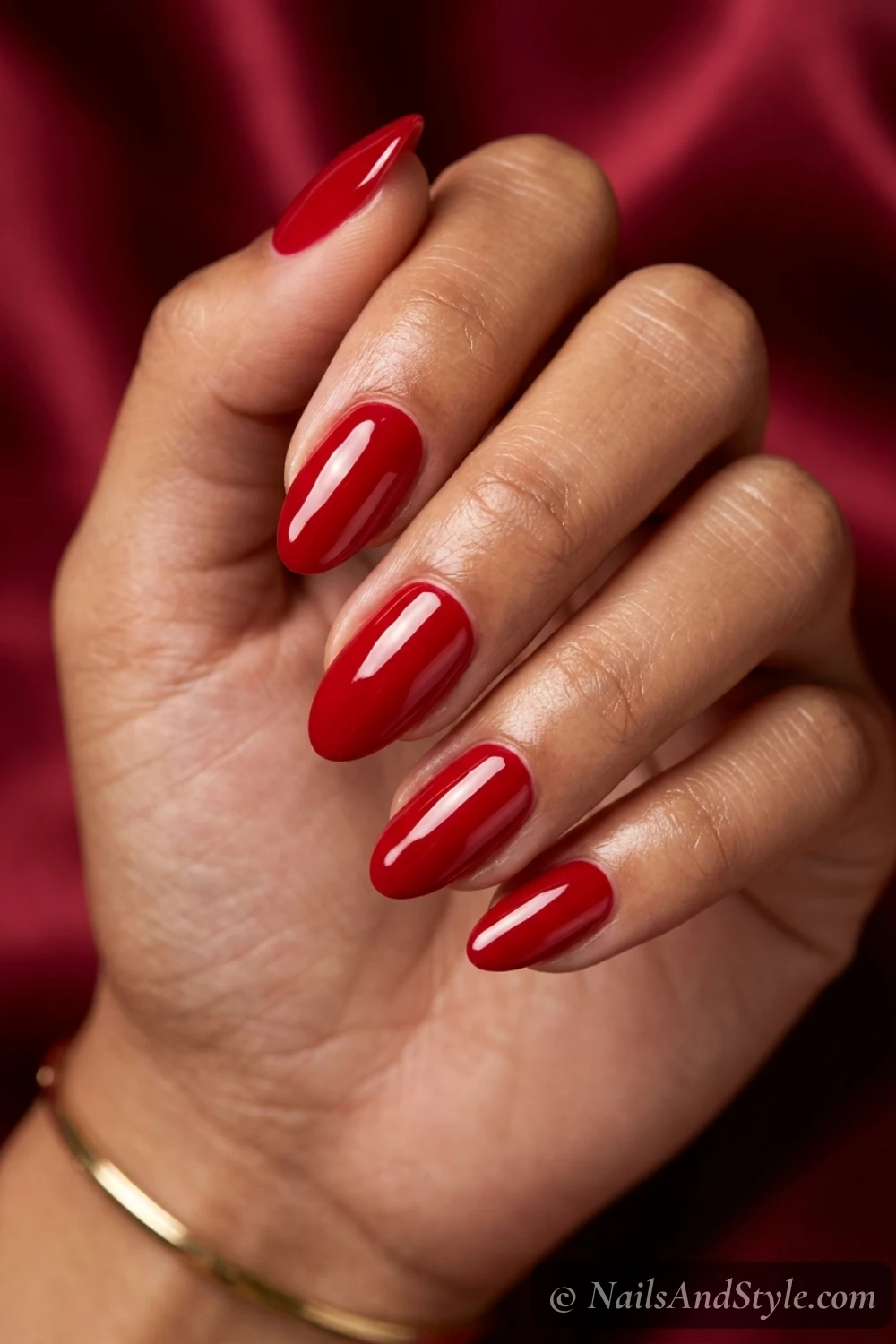 Glossy cherry-red almond nails