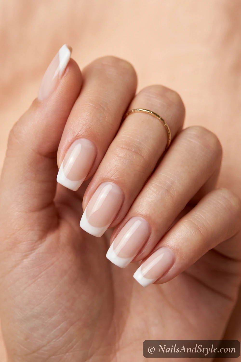 Sheer nude nails with soft white French tips