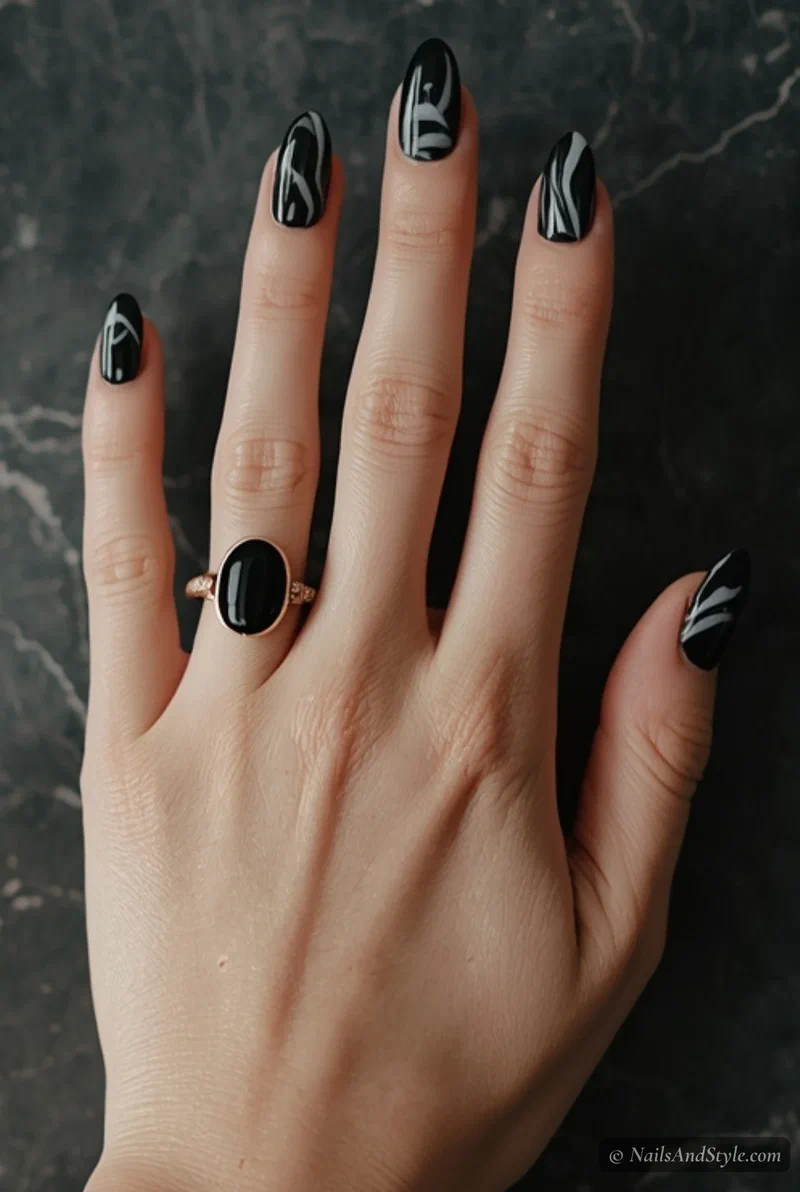 Black marble nails with white and grey swirl details for spring
