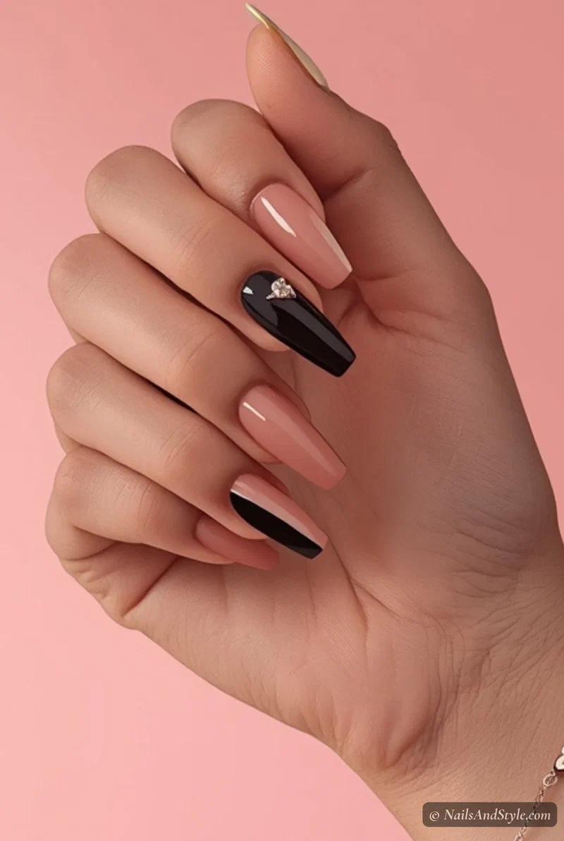 Color block nails split between pastel pink and black for spring