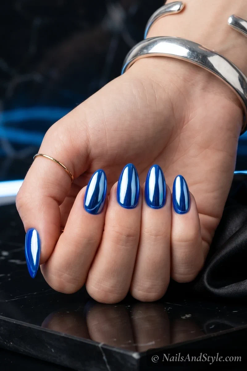 Cobalt blue chrome mirror nails on medium almond shape