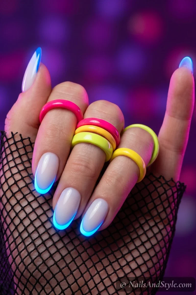 Electric blue neon French tip nails on medium round nails with milky base