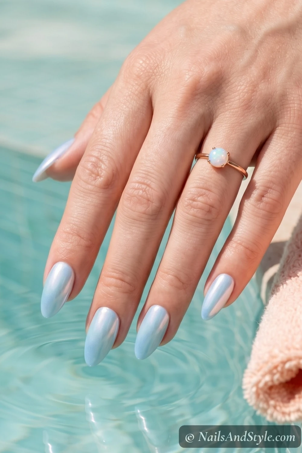 Icy blue pearl chrome nails with a glazed finish