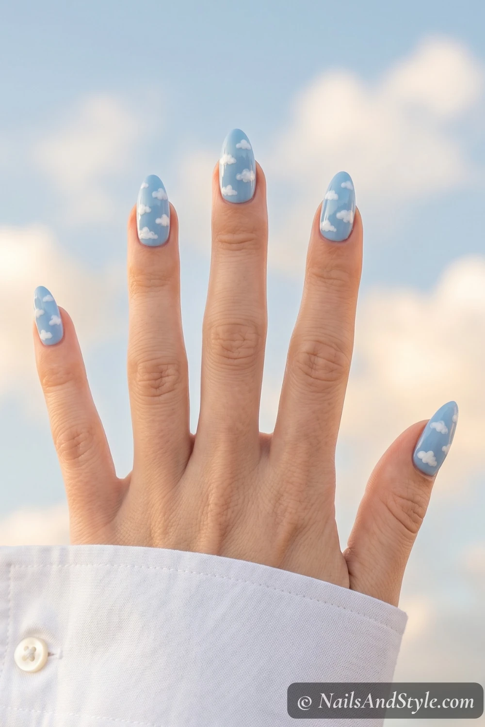 Sky blue nails with fluffy white clouds