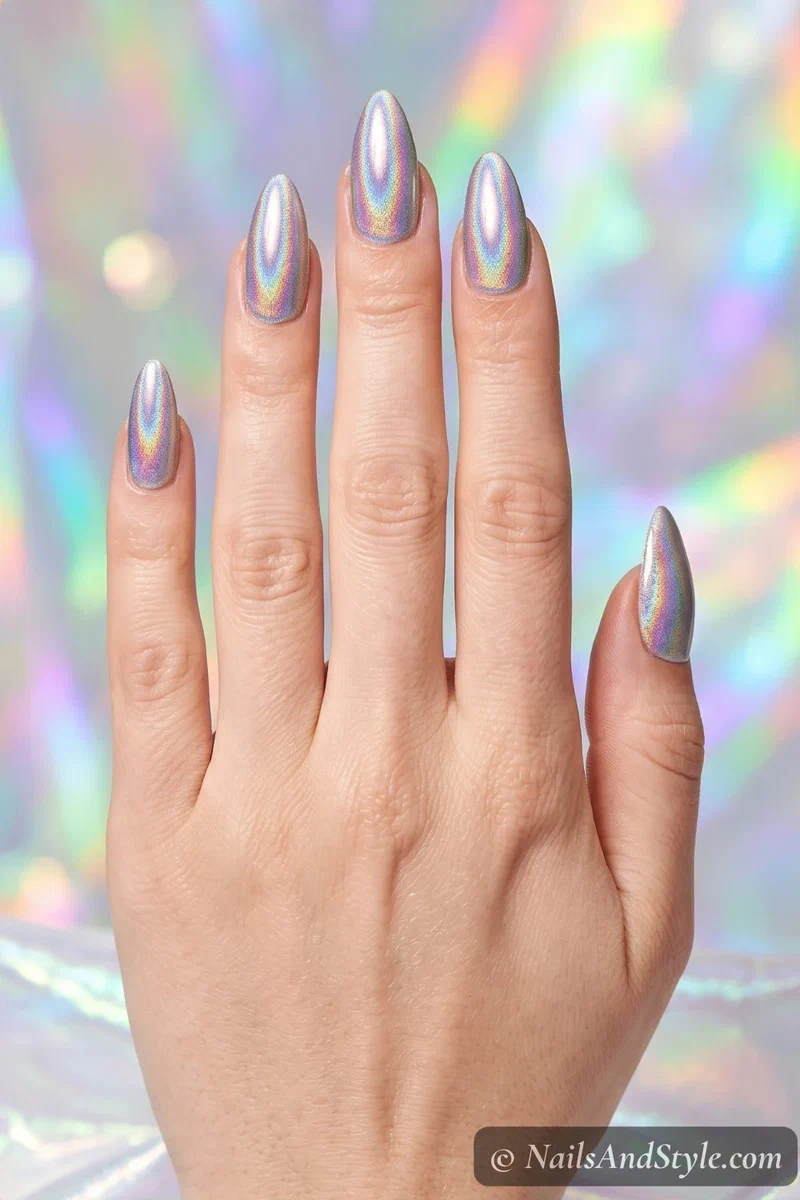 Holographic chrome nails with rainbow light-shifting finish on medium almond nails