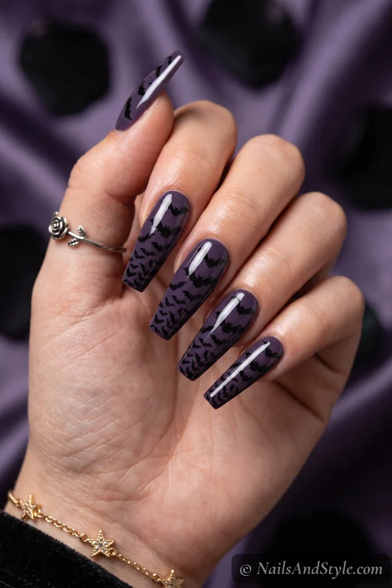 Long purple coffin nails with a swarm of black bats