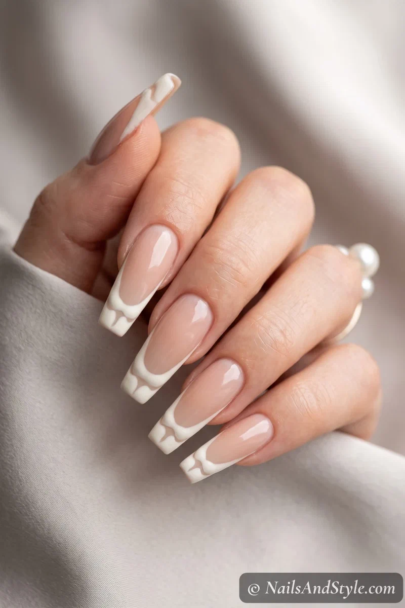 Long nude coffin nails with bone-shaped white French tips