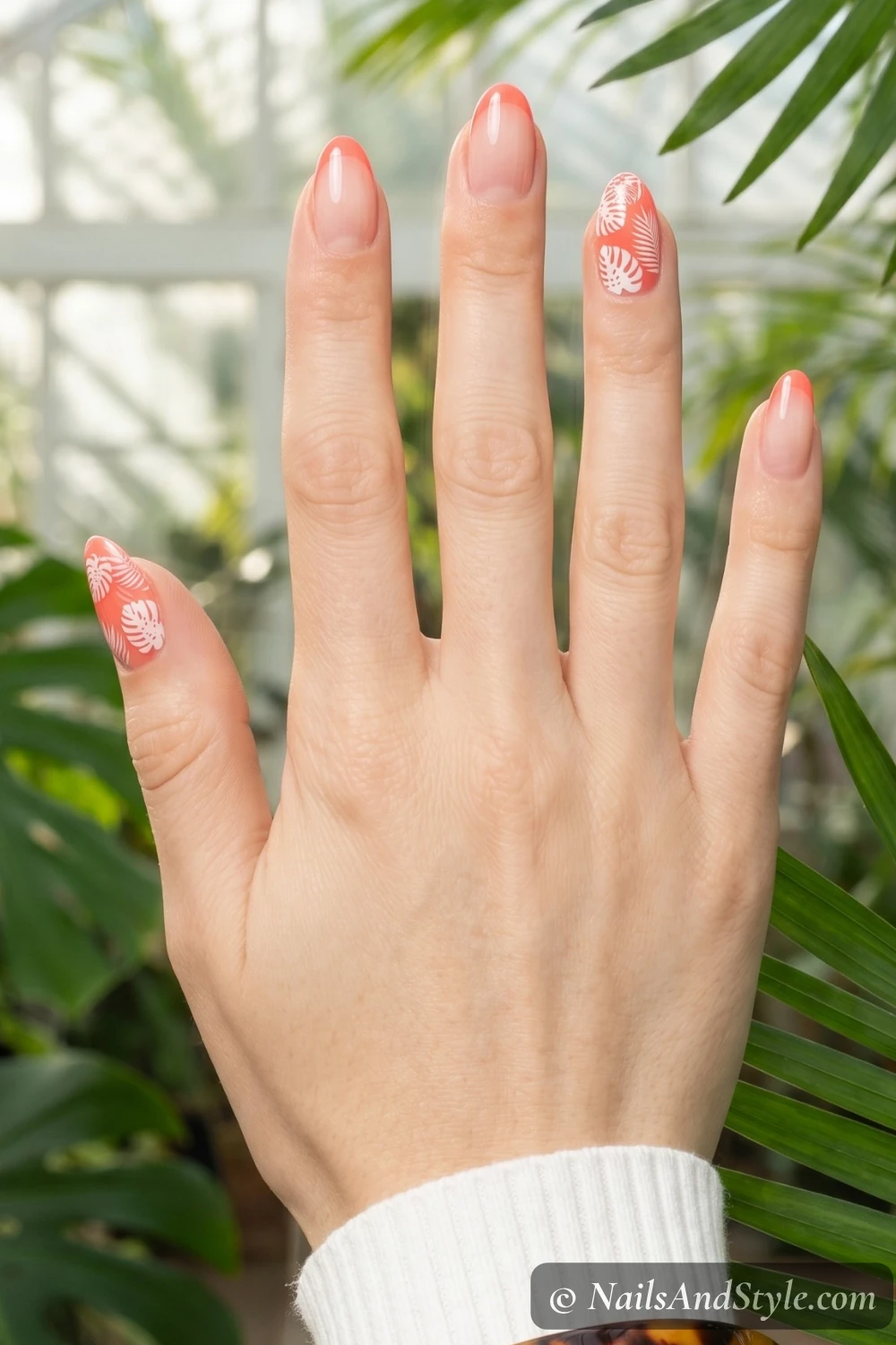 Coral nails with stamped leaves