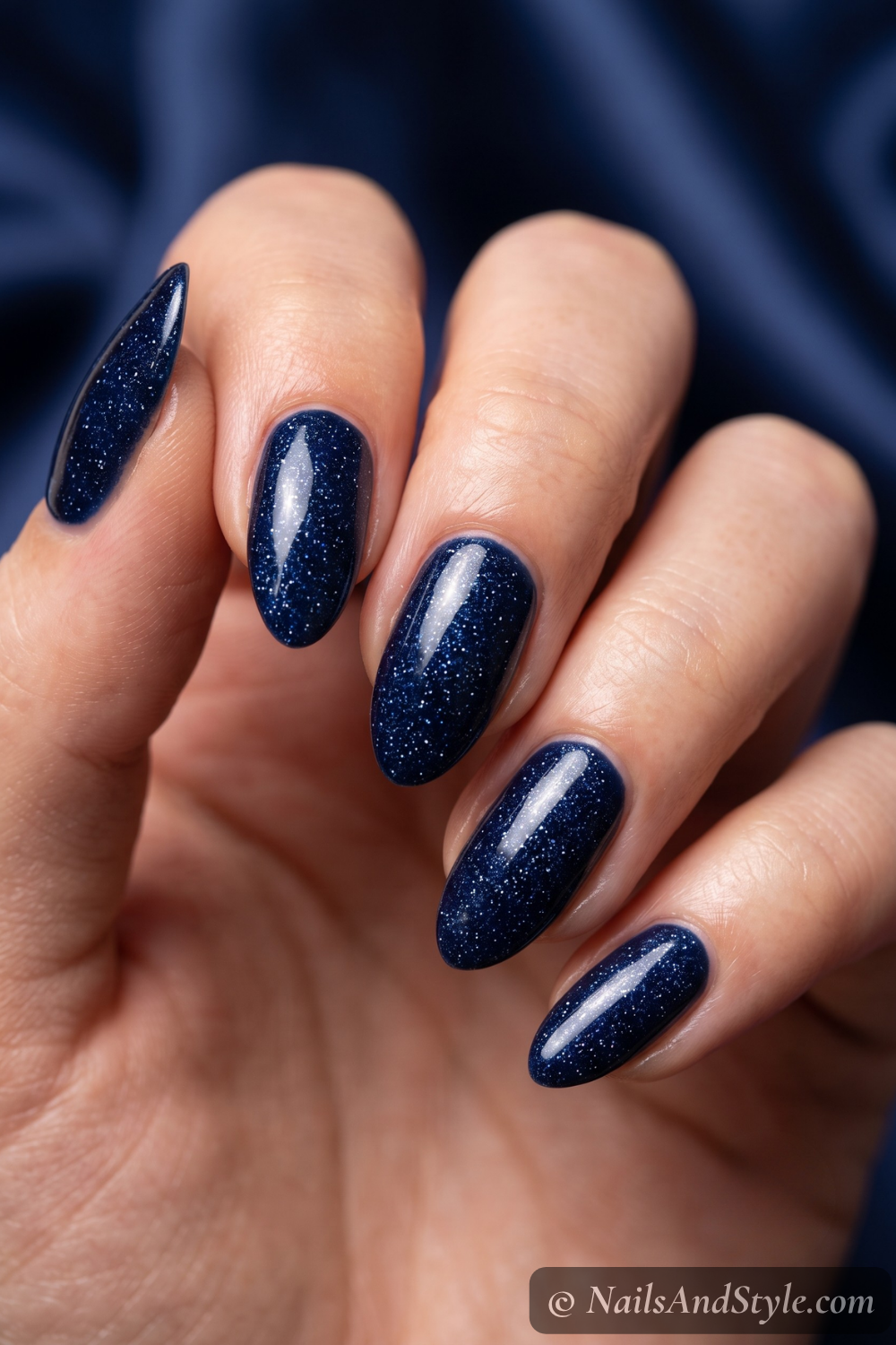Inky midnight-blue shimmer almond nails