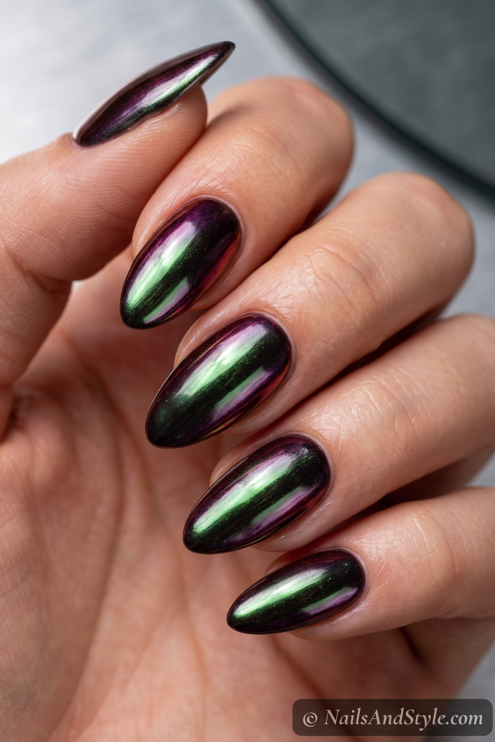 Gunmetal dark-chrome metallic almond nails