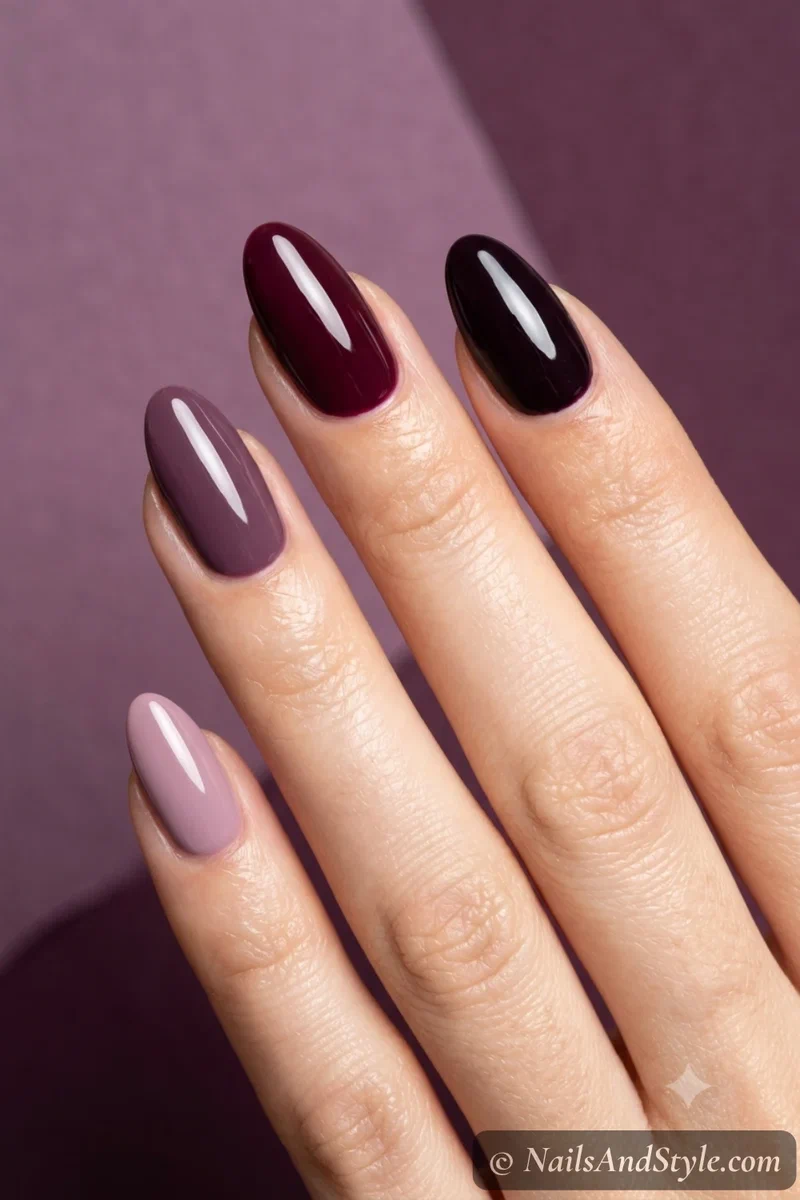 Skittle nails in five shades of plum and burgundy