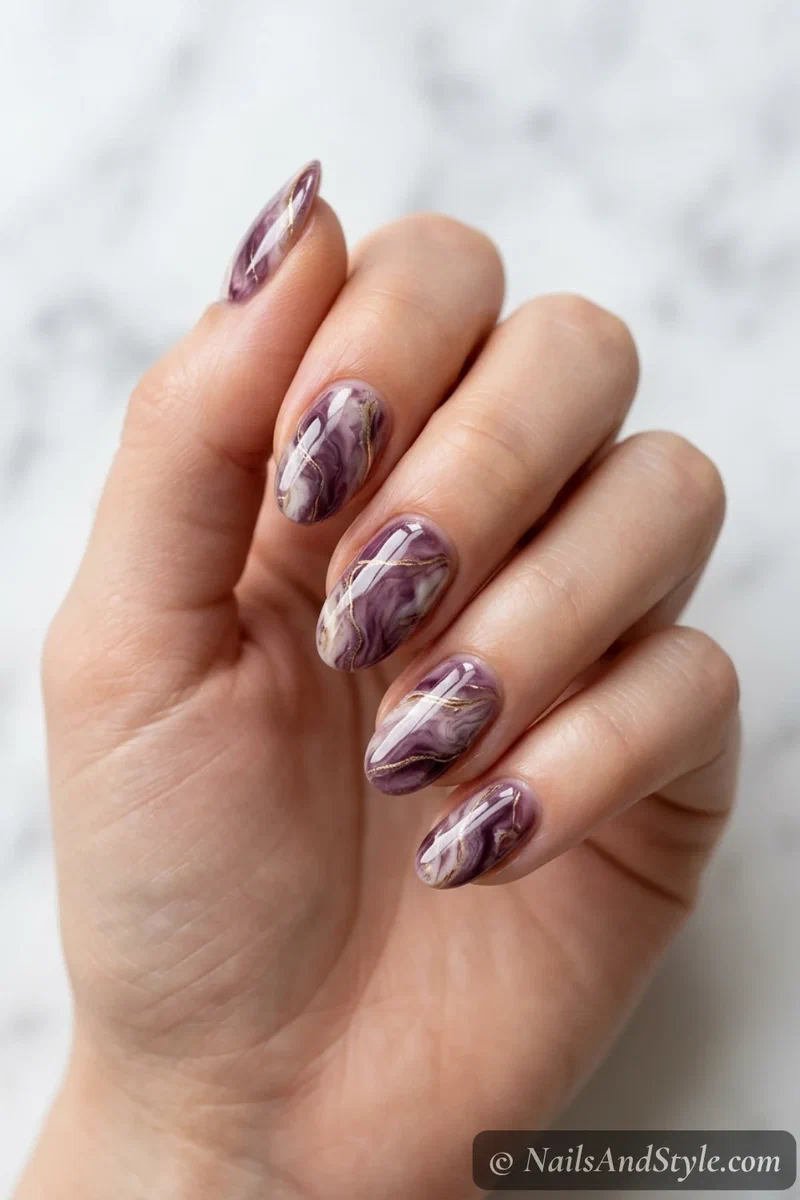 Plum and gold marble nails