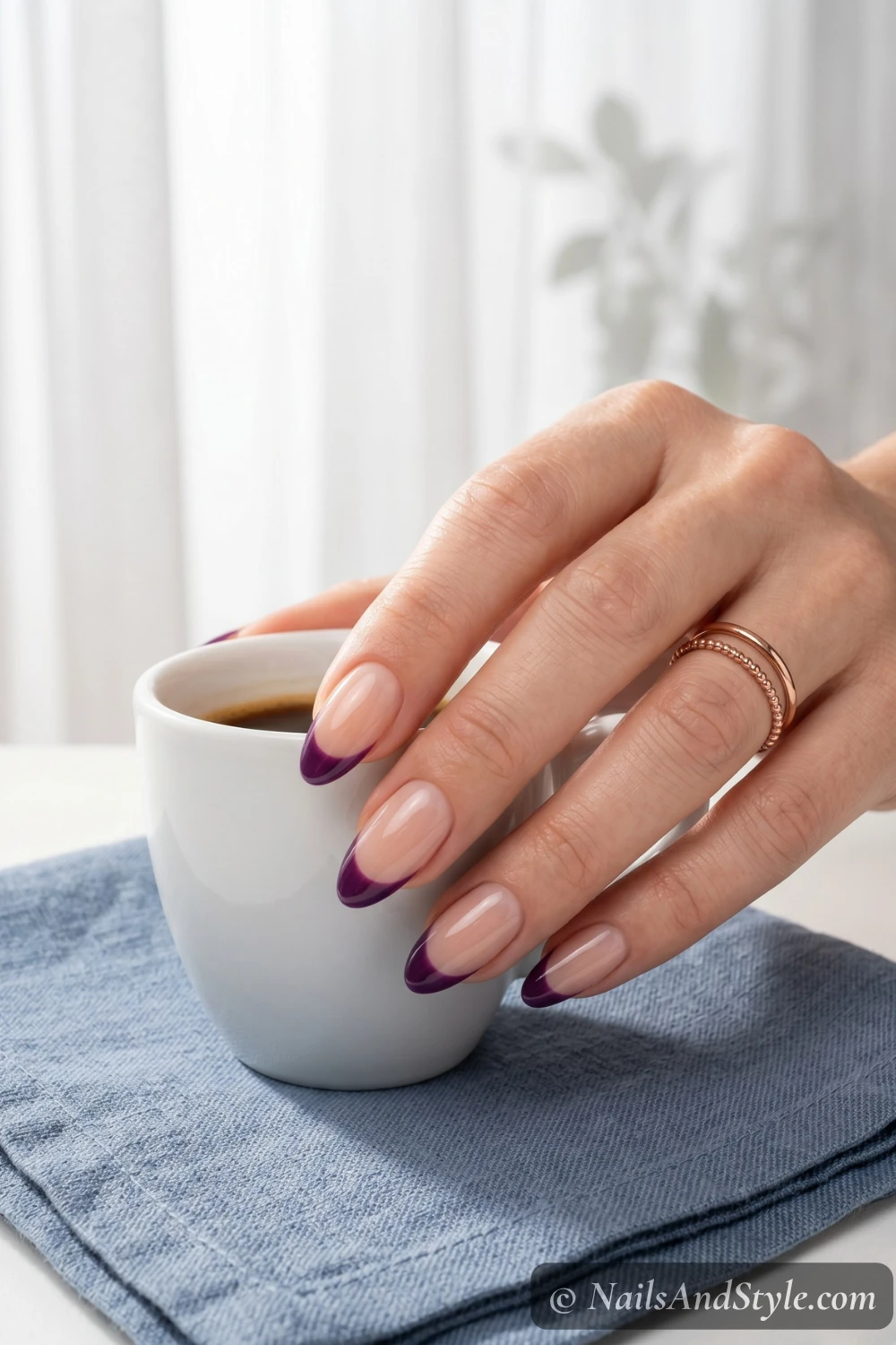 Deep blueberry French tips on a nude base