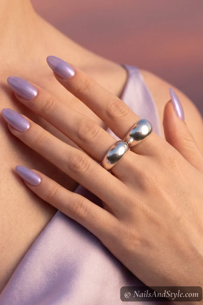 Blueberry glazed donut nails with pearlescent lit-from-within finish on medium almond nails