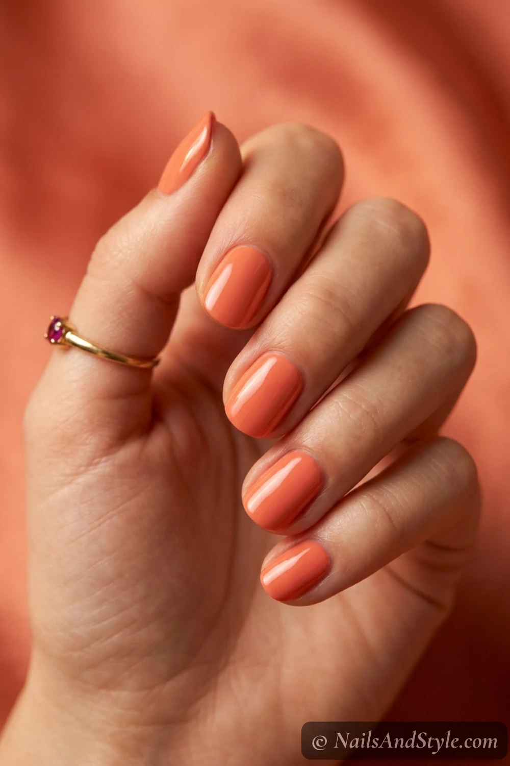 Warm coral gloss nails