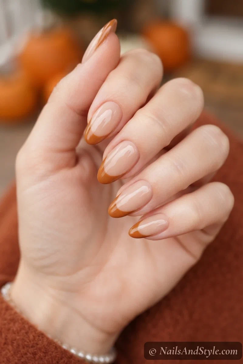 Nude nails with pumpkin brown French tips