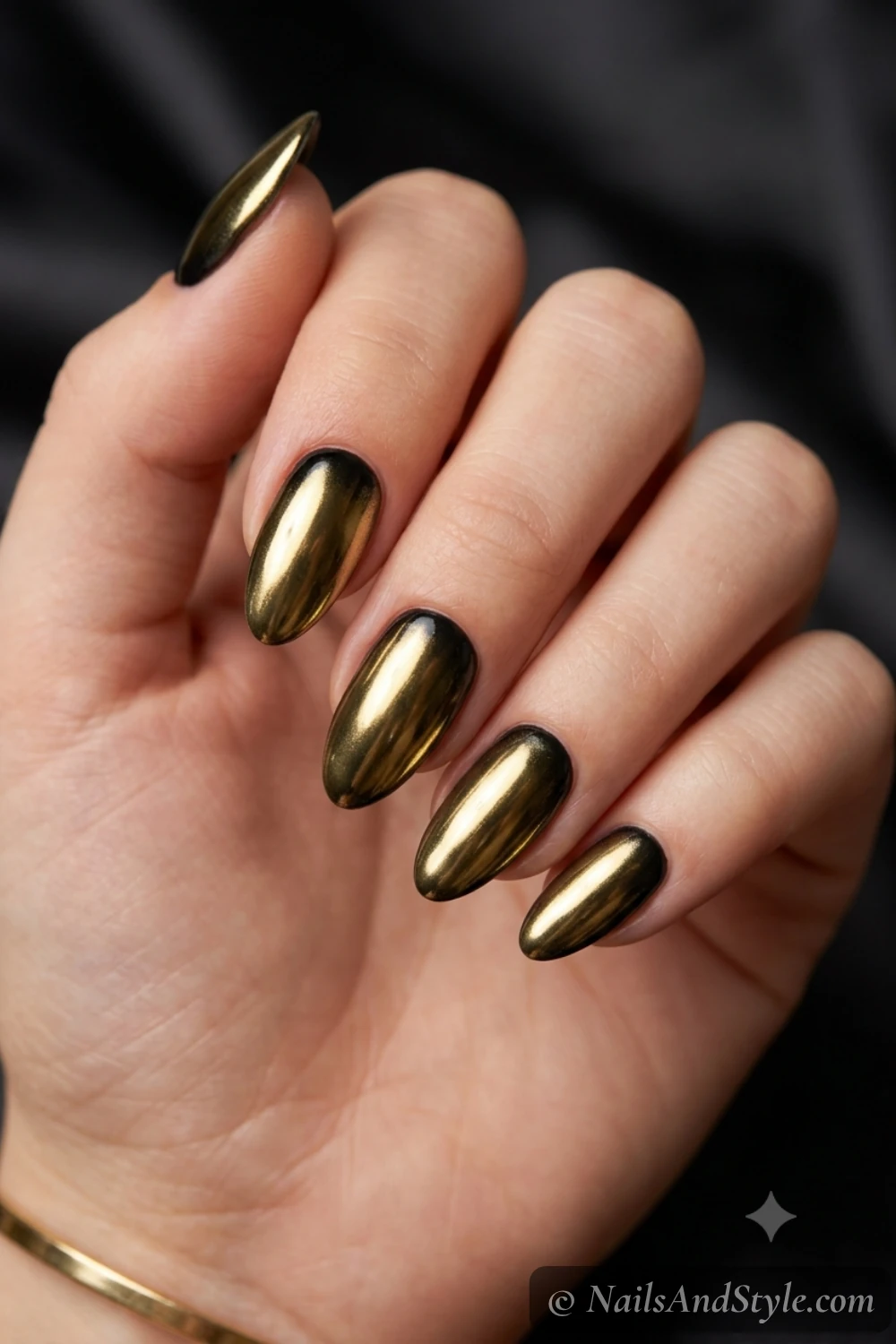 Black and gold chrome nails