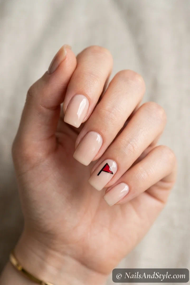 Pennant flag accent nails with a small team-color triangular pennant on one accent nail, medium squoval nails