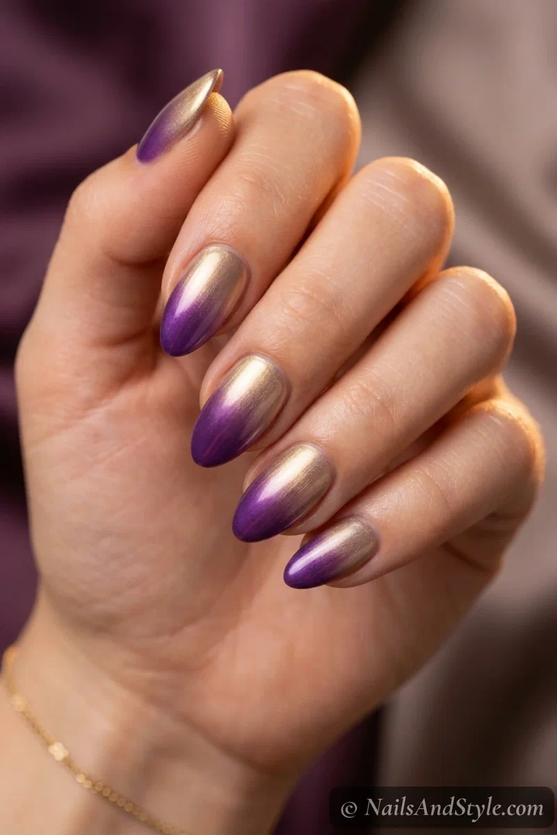 Purple and gold ombre nails blending purple into gold on medium almond nails