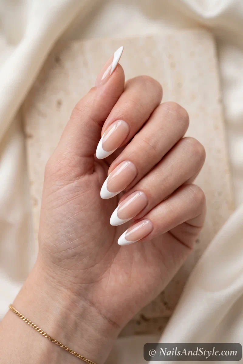 Almond-shaped nails with white French tips