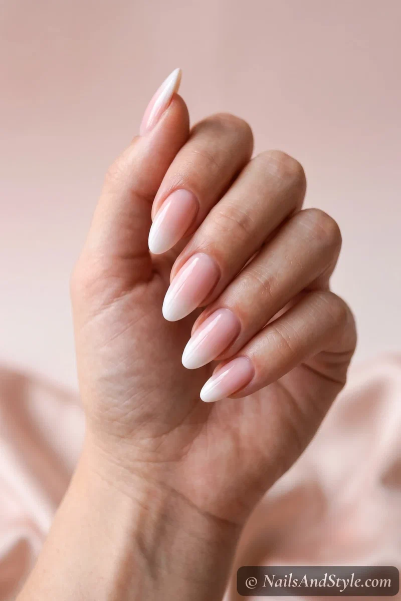 Baby-boomer ombre French tips fading white into pink