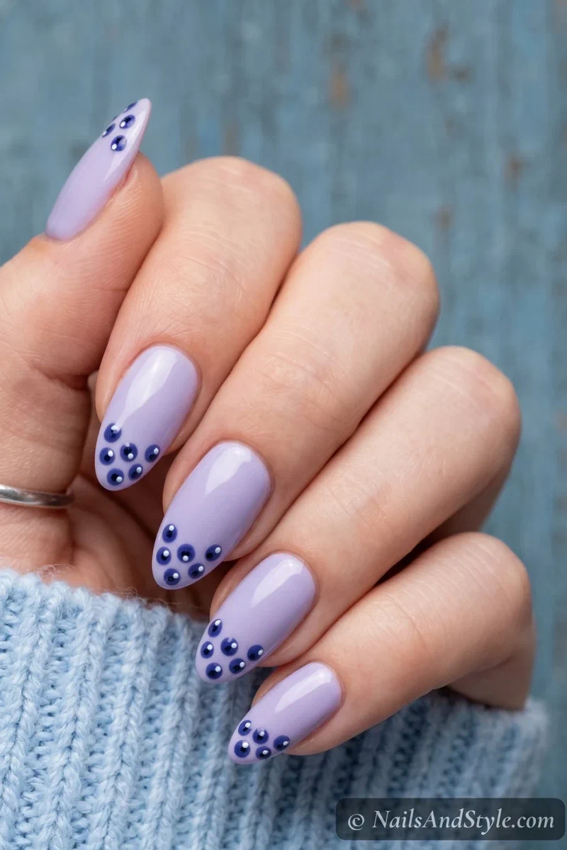Blueberry cluster dot nail art with indigo dots and white highlights on lavender