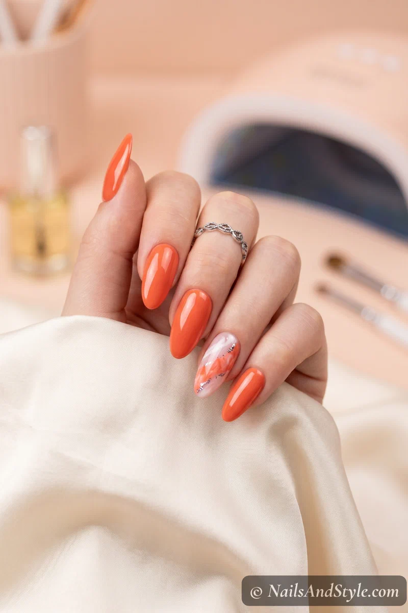 Elegant hand with bright coral gel nails cured under LED lamp showing perfect salon-quality shine