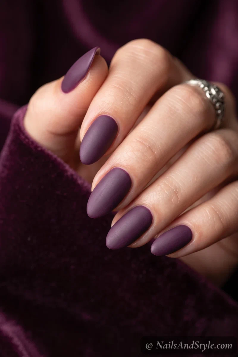 Nails in dusty matte deep plum purple