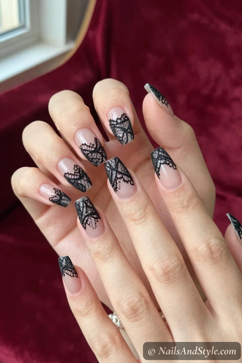 Sheer nails with delicate black lace patterns and scalloped edges