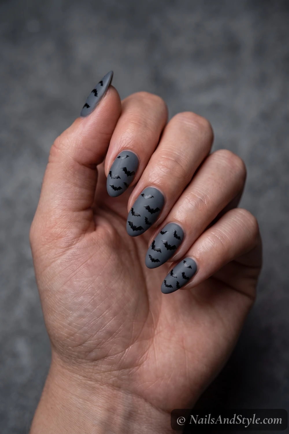 Grey nails with bat decals