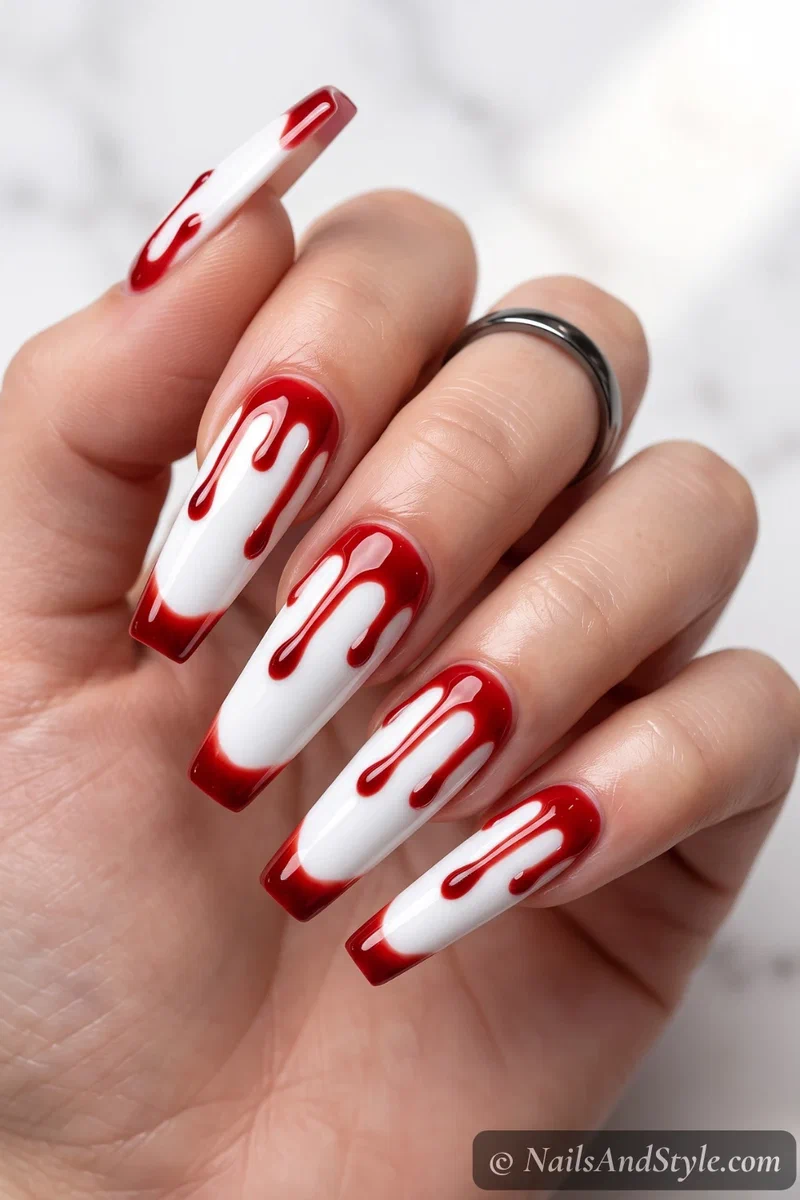 Long coffin nails with glossy red blood drips over white