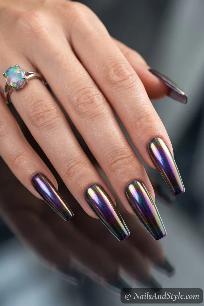 Long nails with a color-shifting chrome and a blended aura glow