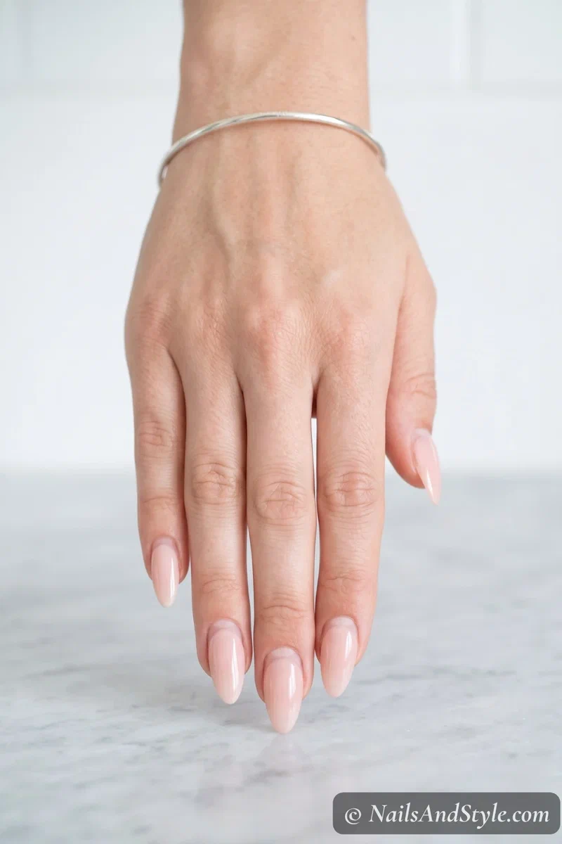 Acrylic nails showing a visible growth gap at the cuticle after two weeks