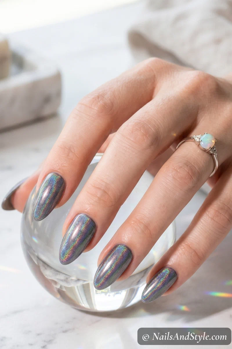 Holographic rainbow chrome nails showing prismatic color shift on medium almond nails
