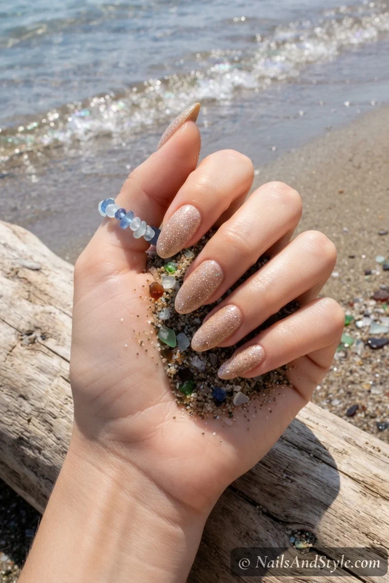Sandy beige nails with iridescent fine glitter topper