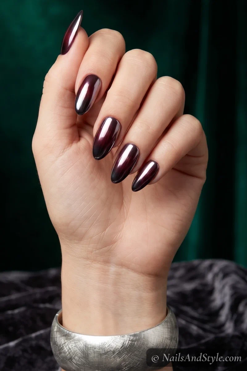 Chrome dusted deep color almond acrylic nails with mirror finish