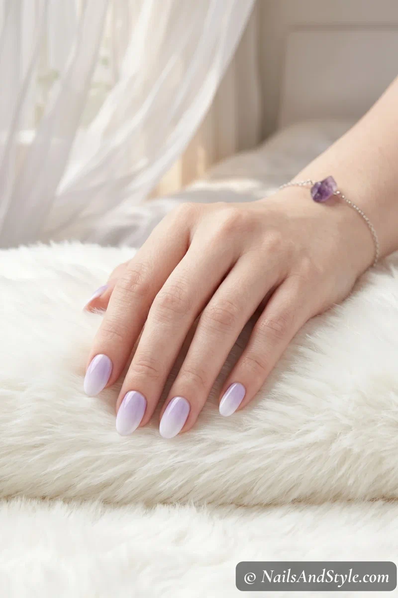 Soft lavender to white cloud ombre nails on short oval nails