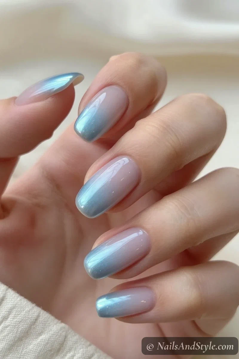 Milky nails with soft icy blue chrome faded tips