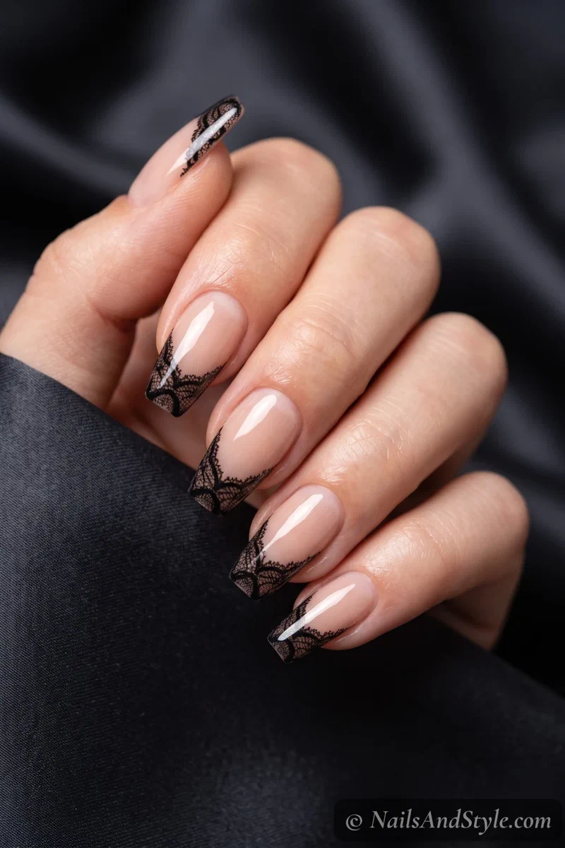 Nude nails with black lace French tips