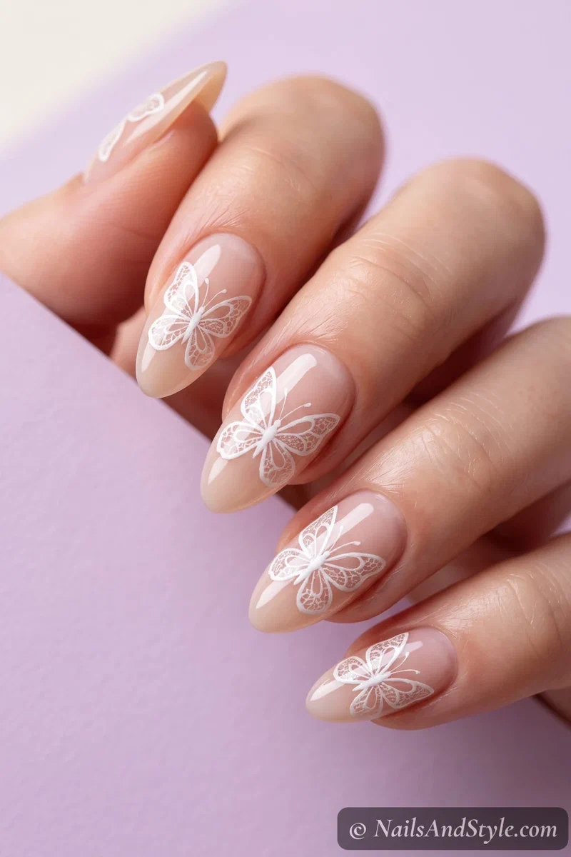 Sheer nails with lace butterfly designs