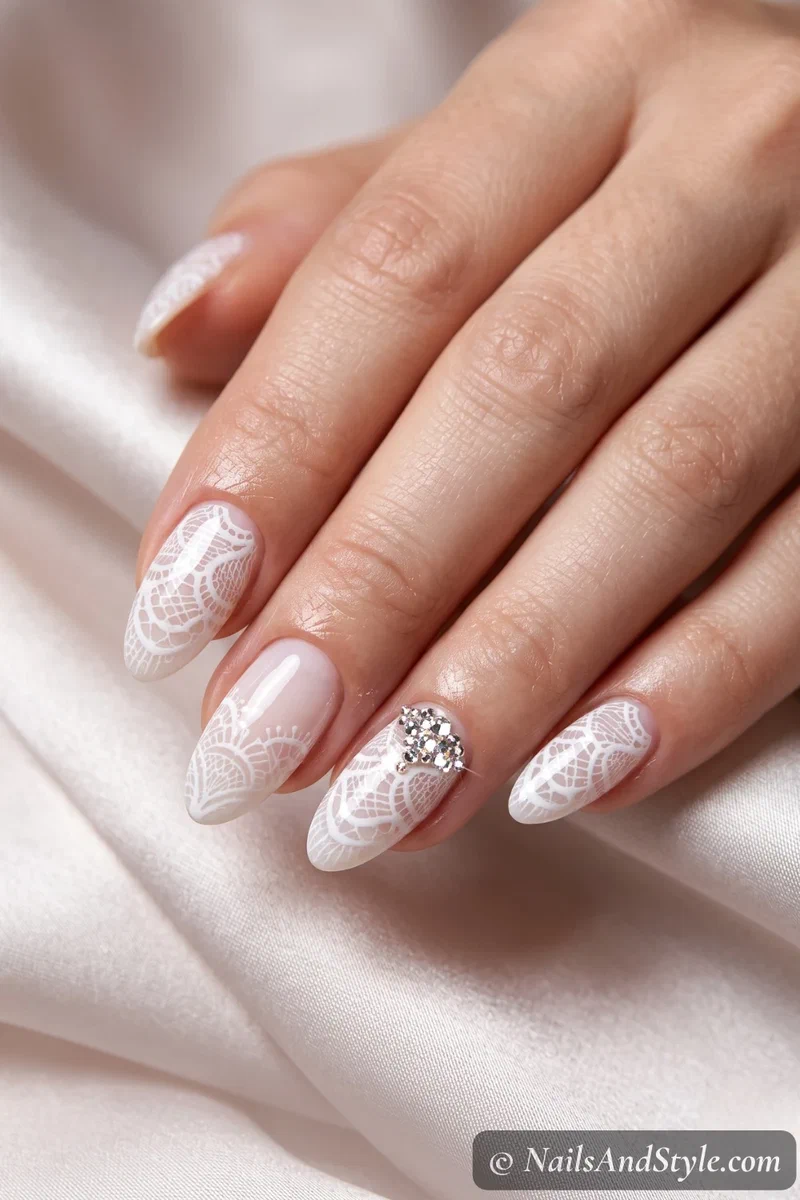 Lace nails with a rhinestone accent