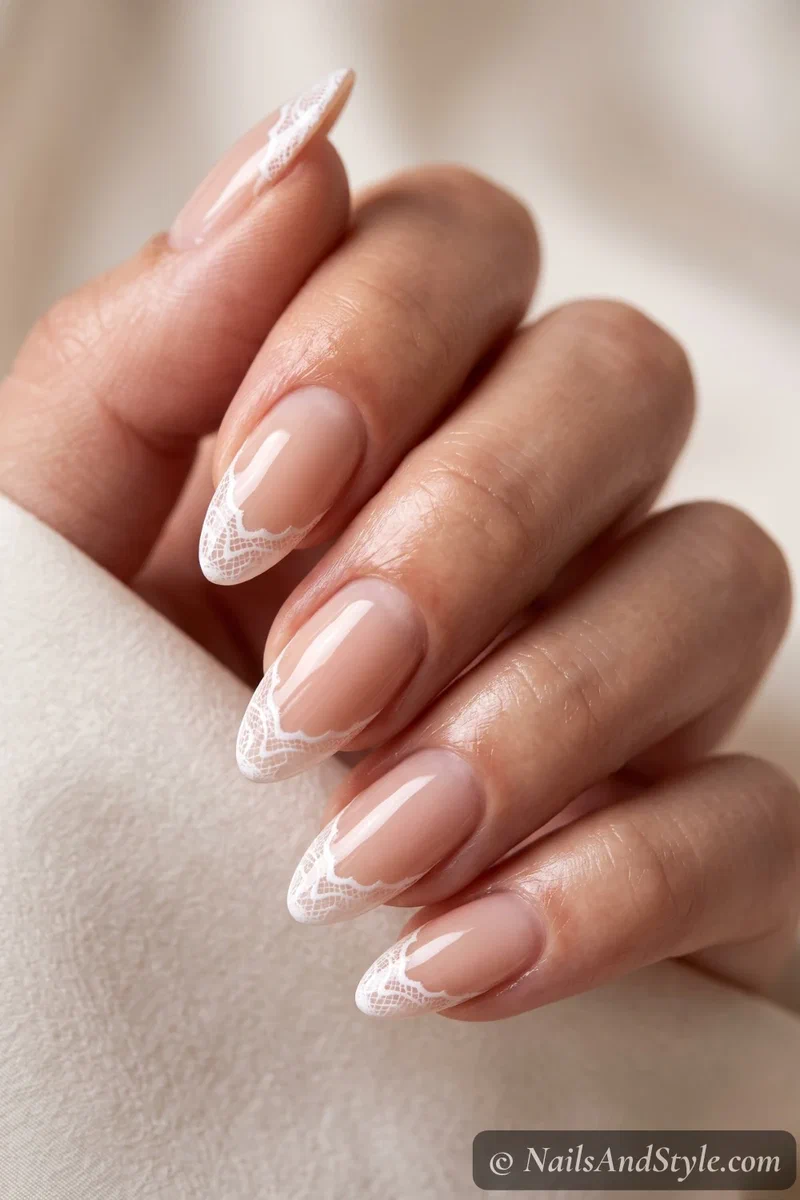 Nude nails with white lace French tips